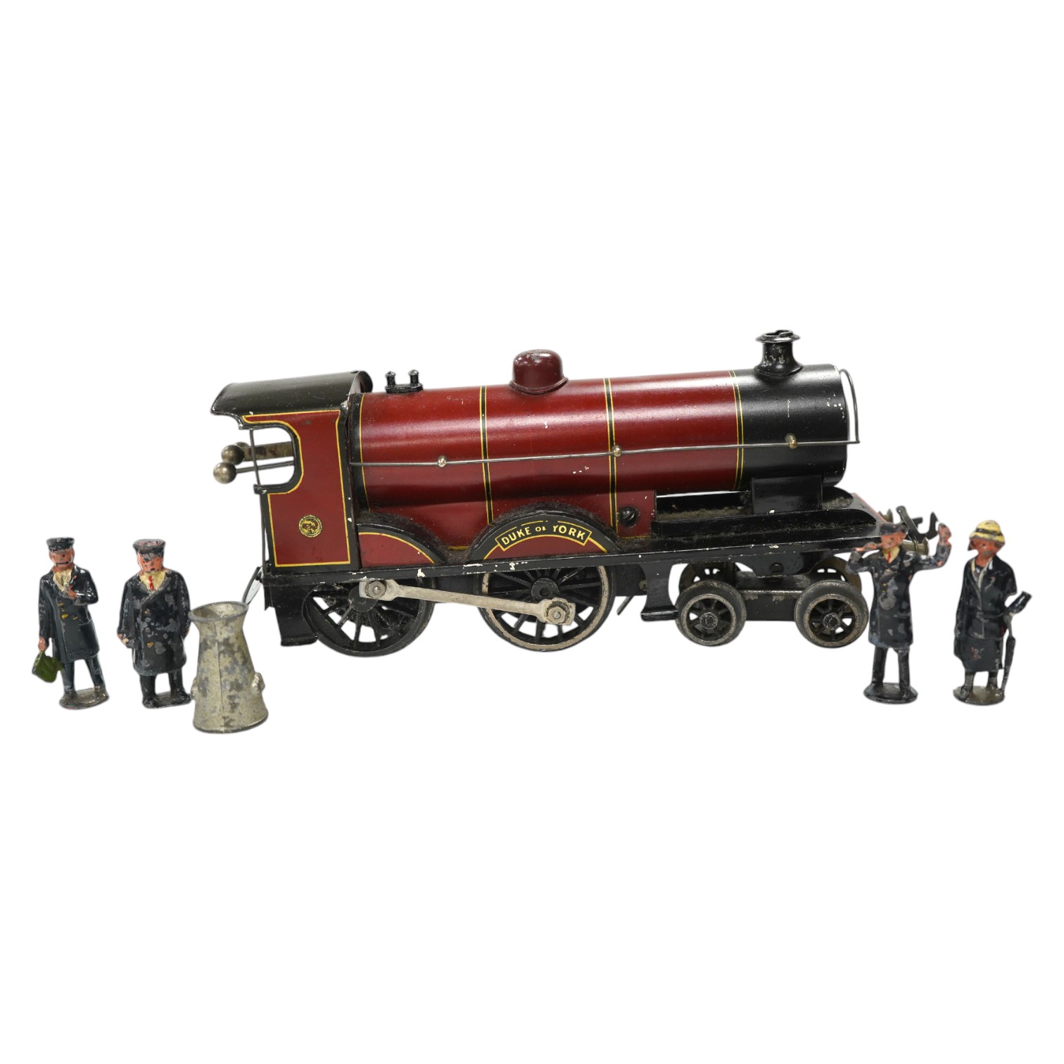 A Bassett Lowke O gauge tinplate clockwork 4-4-0 tender locomotive (missing tender), Duke of York, together with four Crescent/Britains lead railway figures and a milk churn. Condition poor to fair.